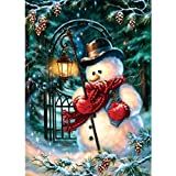 a snowman with a lantern in his hand