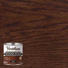 a can of wood stain sitting on top of a table