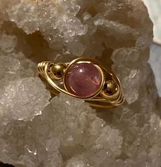 Complete your unique look with this one of a kind, handmade wire wrapped ring. Triple rose colored natural stone, gold colored beaded ring (6mm main stone). Size 8 OUR RINGS ARE... -100% handmade  -their own individual piece of art -Created in an at-home studio  -Made from individual crafting materials  -Natural stone, glass, resin and artistic silver plated wire Care instructions: -Wipe with clean dry cloth -Do not use harsh materials, tools or chemicals to clean -Fragile and delicate design, h Unique Hand Wrapped Pink Jewelry, Handmade Adjustable Rose Quartz Rings, Handmade Elegant Crystal Ring For Healing, Rose Gold Hand Wrapped Ring As Gift, Hand Wrapped Rose Gold Ring Gift, Dainty Handmade Adjustable Crystal Ring, Dainty Wire Wrapped Crystal Ring Gift, Dainty Wire Wrapped Round Ring, Rose Gold Rose Quartz Hand-wrapped Jewelry