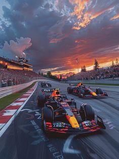 three red and yellow race cars racing down the track at sunset or sunrise with clouds in the background