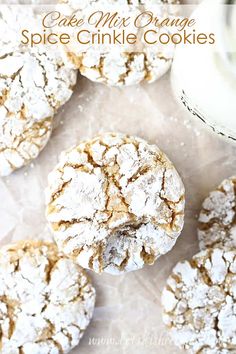 a close up of some cookies on a table with the words cake mix orange spice crinkle cookies