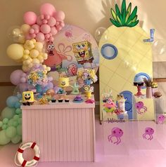 an assortment of balloons and decorations for a spongebob themed birthday party with pineapple