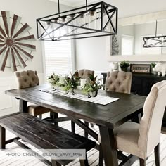 a dining room table with chairs and a bench