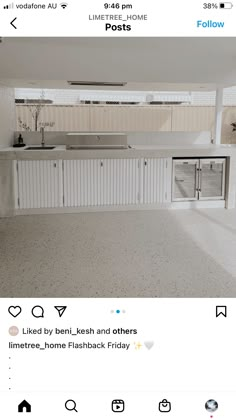 an instagramted photo of a kitchen with white cabinets and counter tops on the right side