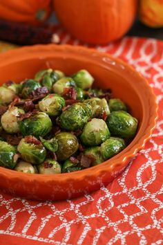 a bowl filled with brussel sprouts on top of a table