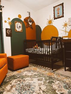 a baby's room decorated in orange and green