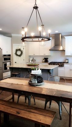 a kitchen with a wooden table and two benches