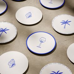 blue and white coasters with palm trees on them are arranged next to each other