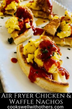 some food is on a white plate with sauce and ketchup in the middle