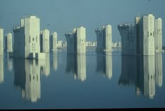 a large body of water surrounded by tall buildings