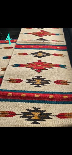 an area rug with different colors and designs