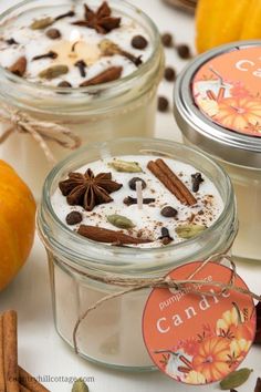 three jars filled with different types of food and cinnamons on top of a table