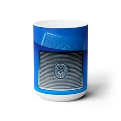 a blue and white coffee mug with the word vw on it's side