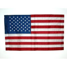 an american flag hanging on a wall with white background and red, white and blue stars