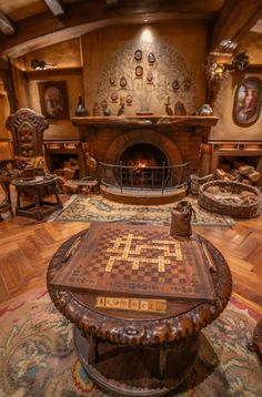 a living room filled with furniture and a fire place in the middle of the room