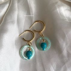 A cool pair of gold hood stud handmade earrings, featuring a blue circle and blue bead. Blue Circle, Drop Dangle Earrings, Fun Earrings, Blue Beads, Gold Hoop, Handmade Earrings