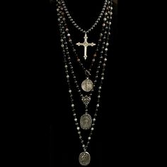 The Hematite Sacred Heart Cross Necklace features 17" of smooth 8mm Hematite and our signature Sacred Heart Cross. Hematite helps to absorb negative energy and calms in times of stress or worry. Hematite is a very protective stone and is great to carry to help you stay grounded in many situations. The French cross with the Sacred Heart on one side and a Lily at the center of the back side is the focal point. It meets in the back with a decorative toggle clasp. Length: 17" Gemstones: 8mm Hematite Guadalupe Necklace, Heart Cross Necklace, Dream Items, Edgy Jewelry, Saint Michael, Our Lady Of Guadalupe, Lady Of Guadalupe, Funky Jewelry, Jewelry Lookbook