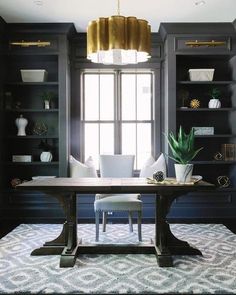 the dining room table is surrounded by built - in bookshelves