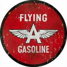 a red flying gasoline sign with white wings