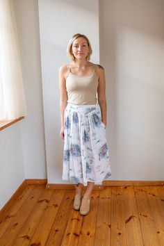 This vintage white summer skirt is light and airy, perfect for warm weather. Its A-line silhouette, reminiscent of the 80s, flatters all body types with a high waist and a stretchy waistband that comfortably fits plus sizes. Ideal for daily wear, vacations, or dates, this midi skirt is both stylish and practical. The inclusion of a single pocket adds a touch of convenience, making it a perfect blend of elegance and functionality. Measurements: Waist: 33cm | 12.9" Waist (fully stretched): 49 cm | Summer Midi Pleated Skirt, Breezy Summer Maxi Skirt With Lined Skirt, Summer Gathered Maxi Skirt For Day Out, Summer Flowy Gathered Maxi Skirt, Flowy Gathered Maxi Skirt For Summer, Summer Breezy Flared Maxi Skirt, Breezy Gathered Skirt For Spring, Breezy Summer Skirt With Elastic Waistband, White Breezy Maxi Skirt For Spring