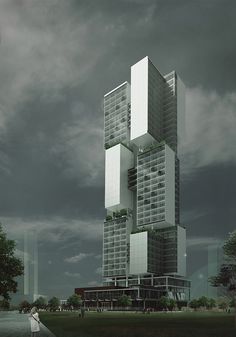 a tall building with lots of windows on the top and bottom floors, in front of a cloudy sky