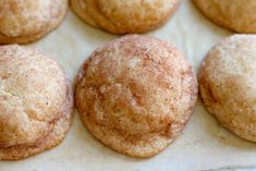 some sugary cookies are sitting on a baking sheet and ready to be baked in the oven