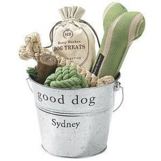 a bucket filled with assorted items sitting on top of a table