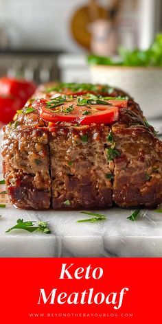 a meatloaf with tomatoes and herbs on it