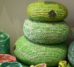 several woven baskets stacked on top of each other