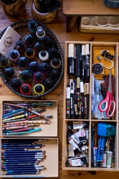 an assortment of crafting supplies are organized in drawers