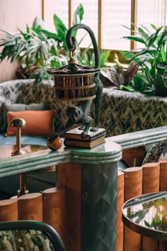 an animal statue on top of a table in a room with couches and tables