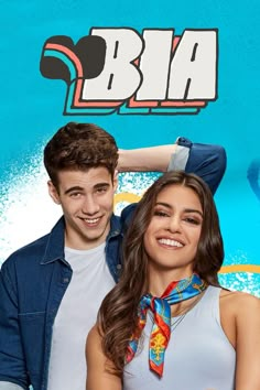 two people are posing for a photo in front of a blue background with the words bia on it