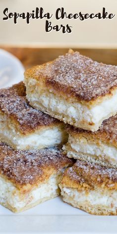 some sugary cheesecake bars stacked on top of each other with the words, sopplila cheesecake bars