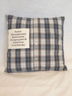 a plaid pillow with a poem written on it