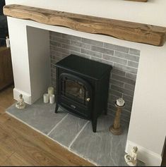 a wood burning stove sitting inside of a living room