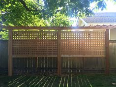 a wooden fence in front of a house