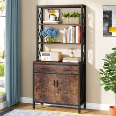 a book shelf with books and plants on it next to a potted plant in front of a window