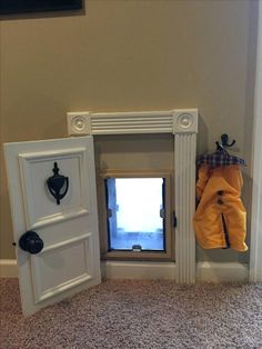 an open door to a small window in a room with carpeted floor and walls