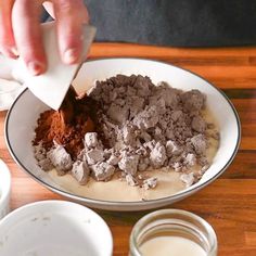 a person is mixing ingredients in a bowl