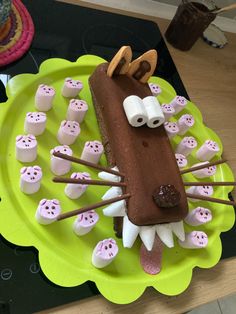 a cake with marshmallows in the shape of a dog