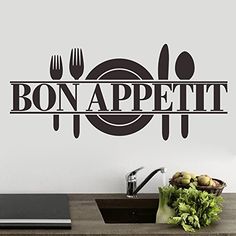 a wall decal with the word bon appetit on it in front of a kitchen counter