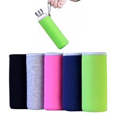 a person is holding a lighter in front of four different colored canisters and one has