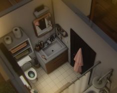 an aerial view of a small bathroom with toilet, sink and mirror