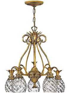 a chandelier with four lights hanging from it's center and three glass shades on the bottom