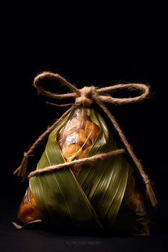 a bag filled with food sitting on top of a black table next to a string