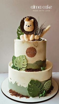 a cake decorated with leaves and a lion on top