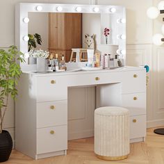 a white vanity with lights on it and a stool in front of the mirror next to it