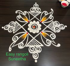 an easy rangolii suneeta design for diwaling on the table