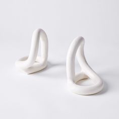 two white sculptures sitting on top of each other