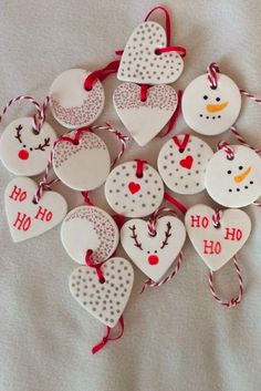 christmas ornaments are arranged in the shape of snowmen and hearts with words on them